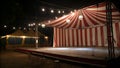 Empty Stage Inside a Red and White Striped Circus Tent at Night Royalty Free Stock Photo