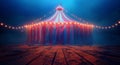 Empty Stage Inside a Red and White Striped Circus Tent at Night Royalty Free Stock Photo