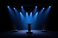 Empty stage with podium and blue spotlights ready for performance Royalty Free Stock Photo