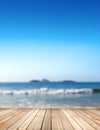 Empty stage for products. Blurred sea background with wood resort deck floor in foreground. Royalty Free Stock Photo