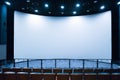 Empty stage in the small movie theater with white screen Royalty Free Stock Photo