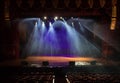 An empty stage of the theater, lit by spotlights and smoke Royalty Free Stock Photo