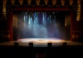 An empty stage of the theater, lit by spotlights and smoke Royalty Free Stock Photo