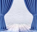 Empty stage with white brick wall and blue curtains with focus on white wood plank floor