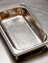 Empty stainless steel baking tray on a clean kitchen surface. Royalty Free Stock Photo
