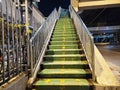 Empty staircase, green staircase, yellow sign to walk up or down to the overpass Royalty Free Stock Photo