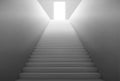 White staircase with light from open door on top