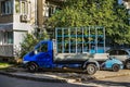 Empty stationary semi truck with glass rack for pane transportation on a city street. PVC windows delivering. Construction and Royalty Free Stock Photo