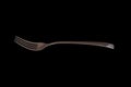Empty Steel Fork isolated on black background Royalty Free Stock Photo