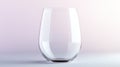 Clear Stemless Wine Glass on Soft Pink Background, Empty Modern Drinkware Royalty Free Stock Photo