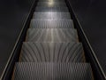 Empty step of escalator going down Royalty Free Stock Photo