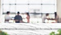 Empty step marble table top food stand with blur people in coffee shop background bokeh light and leaf foreground,Mock up for dis Royalty Free Stock Photo