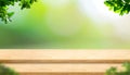 Empty step plank wood table top with blur tree in park with bokeh light background and leaves foreground,Mock up template for dis Royalty Free Stock Photo