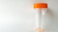 Empty sterile stool sample collection container with orange cap. Medical specimen jar for fecal analysis. Concept of Royalty Free Stock Photo