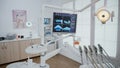 Empty stomatology orthodontic office room equipped with professional dentistry tools