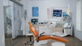 Empty stomatology orthodontist office room with medical drill and dental teeth xray images