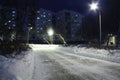 Empty stone causeway, residential building and white snow Royalty Free Stock Photo