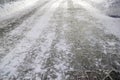 Empty stone causeway and white snow in park at winter night Royalty Free Stock Photo