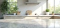 Empty stone countertop table in modern kitchen. Sunlight from window illuminates granite surface. Blurred interior background Royalty Free Stock Photo