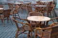 Stone table and wooden chairs of street cafe Royalty Free Stock Photo