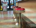 Empty Stools at a counter in a city market