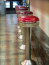 Empty Stools at a counter in a city market