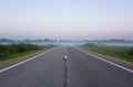 Empty Straight Suburban Asphalt Road In Misty Morning At Dawn Royalty Free Stock Photo