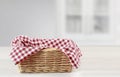 Empty straw basket with red checkered picnic cloth empty space food advertisement design Royalty Free Stock Photo