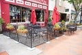 empty street cafe along a pedestrian sidewalk in an old American town. Tables and chairs