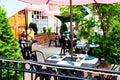 empty street cafe near restaurant in an old American town. Tables and chairs Royalty Free Stock Photo