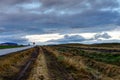 Empty street with cloudy sky and Icelandic Landscape during Sunr Royalty Free Stock Photo