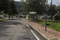 An empty street with destroyed bus stop and burned pavement resulting damages of disturbs between ESMAD and protesters