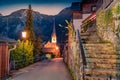 Empty street of Hallstatt village with Pfarrkirche Maria Himmelfahrt Catholic church