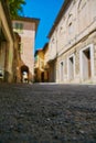 Empty Street in the Italian town Fossano in Province Cuneo, Region Piedmont, northern Italy. Royalty Free Stock Photo