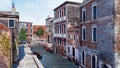 Empty street with old buildings in Venice, Italy