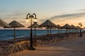 Empty street, sea and old lamp in Dahab resort Egypt