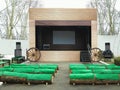Empty street stage with green seats before performance Royalty Free Stock Photo