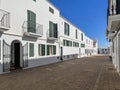 empty street on a summer afternoon in the historic center of the picturesque white village of Fornells in Menorca