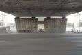 Empty street under a bridge in Riga, Latvia. Reconstruction of the bridge over highway Royalty Free Stock Photo