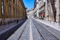 Empty streets with tram rails and overhead lines in Lisboa Royalty Free Stock Photo