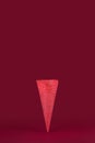 Empty sugar waffle cone on red background Royalty Free Stock Photo