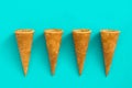 Empty summer ice cream cornets on blue background