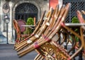 An empty summer outdoor area of a restaurant or cafe in a historic downtown is closed during lockdown. Tables and chairs without