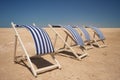Empty sun chairs in a row Royalty Free Stock Photo