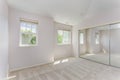 Empty sun filled bedroom with carpet floor. Royalty Free Stock Photo