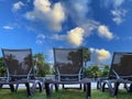 Empty sun loungers near the pool in resort. End of seasonal tourism