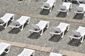 Empty sun loungers stand under a canopy on the beach Royalty Free Stock Photo