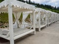 Empty sun loungers stand under a canopy Royalty Free Stock Photo