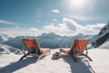 Empty sun loungers on top of a snowy mountain Holidays at a ski resort.