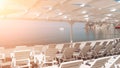 Empty sun loungers under a canopy on the beach. The beach area is empty. No people. White plastic sunbeds under the sun Royalty Free Stock Photo